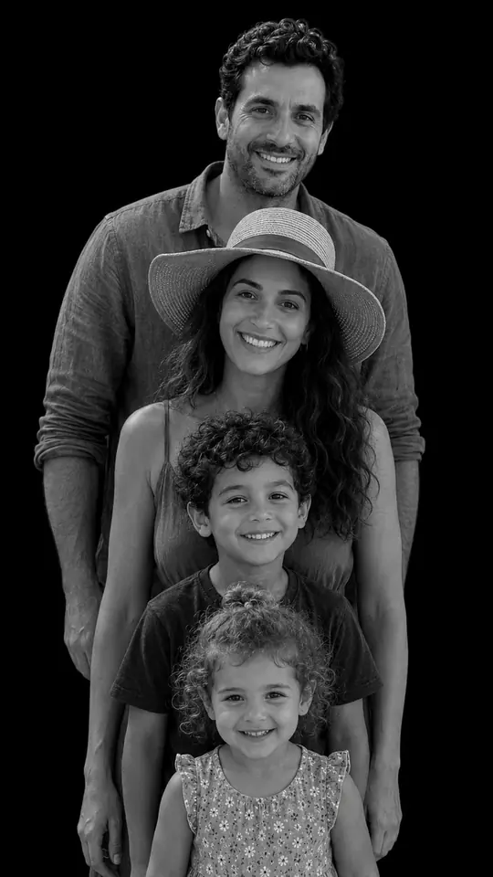 The same family restaged as a monochrome studio portrait on a black background, stacked tallest at the back to youngest at the front